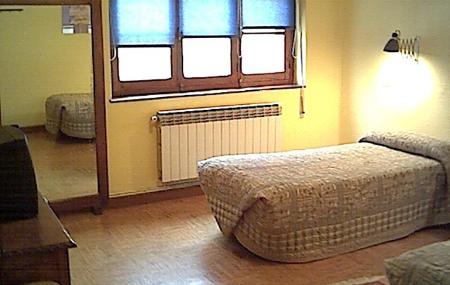 Pensión Senda del Huerna habitación